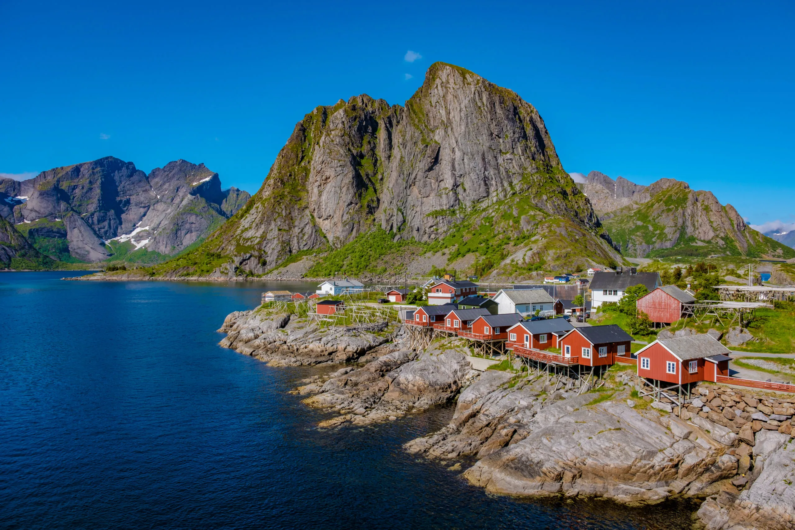 red-cabins-nestled-among-norwegian-mountains-hamn-2025-01-09-18-35-36-utc-scaled