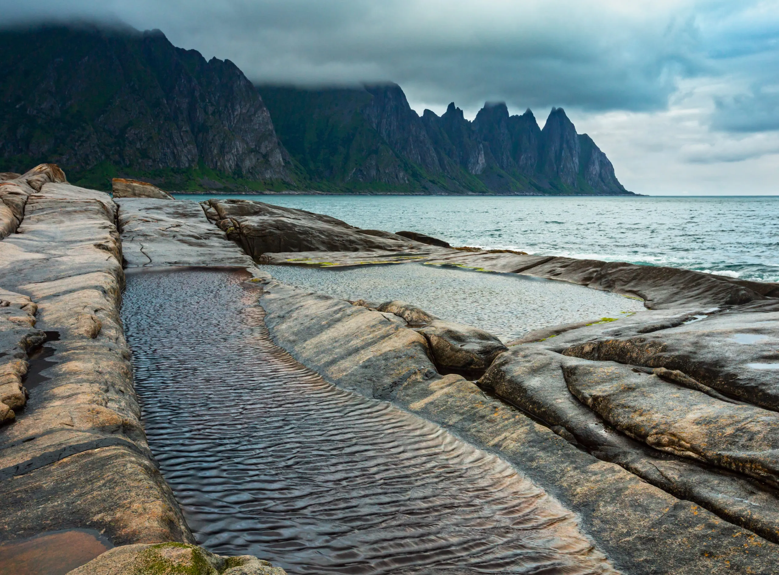 stony-beach-with-tidal-baths-at-ersfjord-senja-n-2025-10-10-14-46-47-utc-scaled