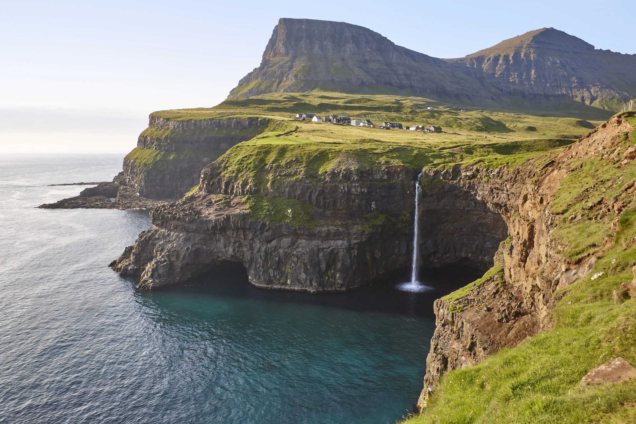 waterfall-and-cliffs-on-vagar-faroe-islands-coast-2025-01-27-17-25-39-utc-scaled